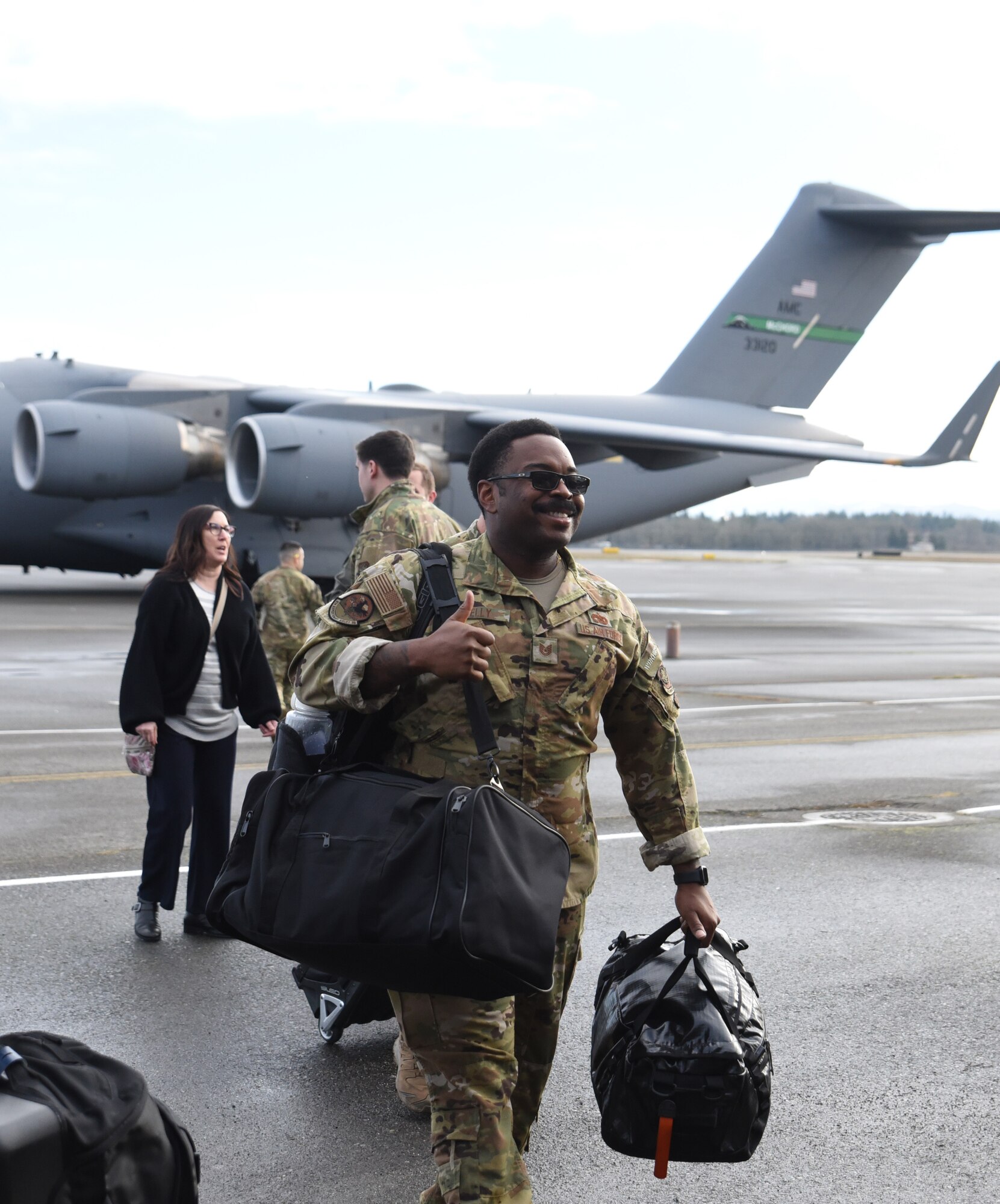 Team McChord Airmen reunite with friends and family after returning from a deployment at Joint Base Lewis-McChord, Washington, Jan. 3, 2023. Nearly two-dozen Team McChord Airmen returned home after being deployed for several months. (U.S. Air Force photo by Airman Kylee Tyus)
