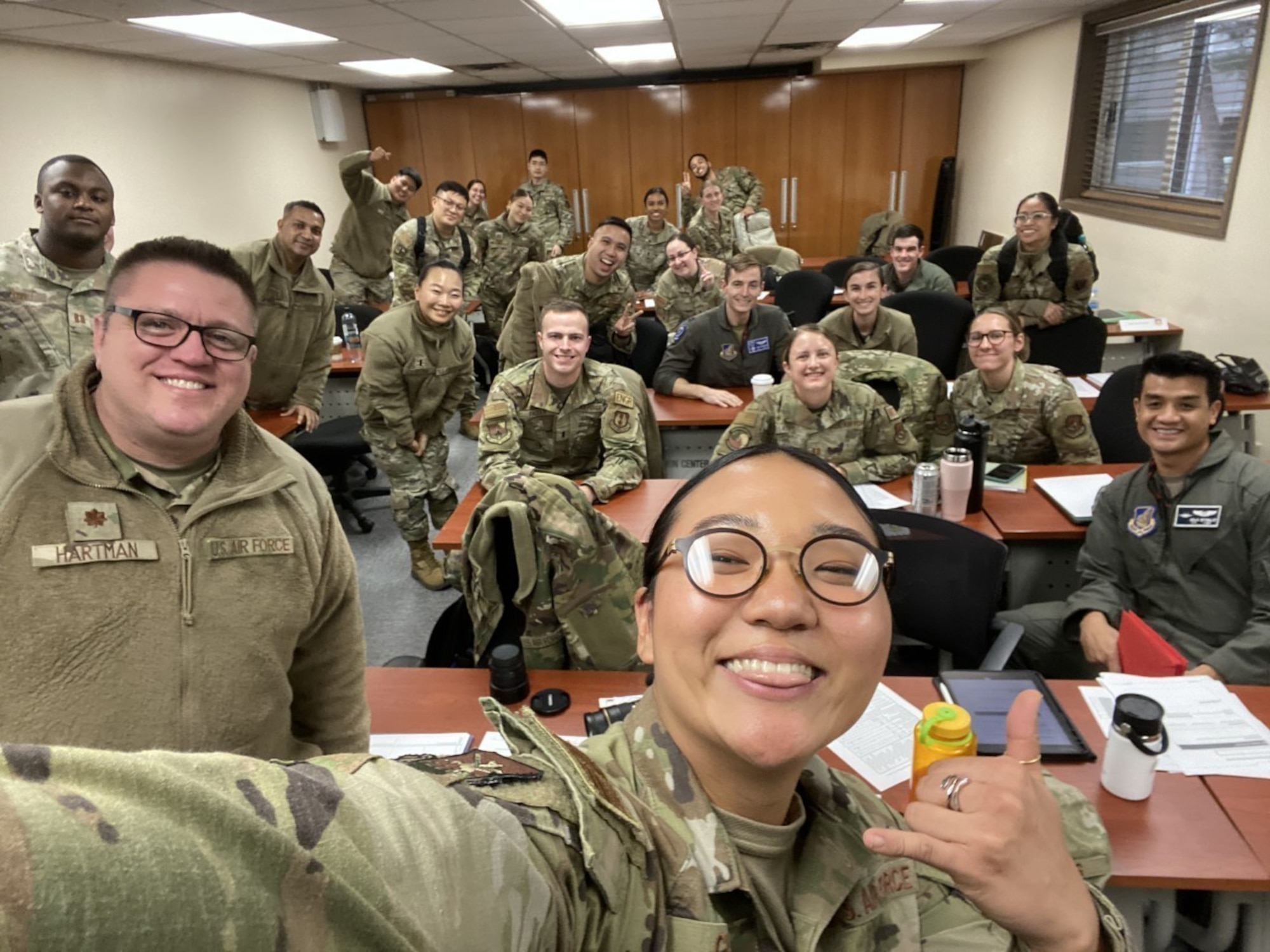 1st Lt Michelle Chang poses for a selfie with classmates and instructor at the conclusion of a Flight Commander Leadership Course at Osan Air Base, Republic of Korea, Dec. 7, 2022.
