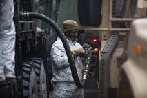 U.S. Marine Corps Lance Cpl. Jesse Roberts, motor transportation operator, with Combat Logistics Battalion 6 (CLB-6), Combat Logistics Regiment 2, 2nd Marine Logistics Group, refuels a Joint Light Tactical Vehicle during convoy operations in Syndalen, Finland, Nov. 28, 2022. Task Force Red Cloud, headquartered by elements of CLB-6, is deployed to Finland in support of Exercises SYD 2022 and Freezing Winds 2022 to enhance U.S. and Finnish select interdependence in the maritime domain; solidify bilateral maritime maneuver within the Finnish littoral environment; and foster strong relationships between U.S. Marine Corps and Finnish Defense Force sustainment units. (U.S. Marine Corps photos by CWO2 Brian A. Lautenslager)