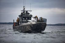 U.S. Marines with Combat Logistics Battalion 6 (CLB-6), Combat Logistics Regiment 2, 2nd Marine Logistics Group along with Finnish soldiers from Nylands and Coastal Brigade, are transported in a Finnish Jehu-700 class landing craft while monitoring an unmanned surface vehicle during a training event off the coast of Syndalen, Finland, Nov. 25, 2022. Task Force Red Cloud, headquartered by elements of CLB-6, is deployed to Finland in support of Exercises SYD 2022 and Freezing Winds 2022 to enhance U.S. and Finnish select interdependence in the maritime domain; solidify bilateral maritime maneuver within the Finnish littoral environment; and foster strong relationships between U.S. Marine Corps and Finnish Defense Force sustainment units. (U.S. Marine Corps photos by CWO2 Brian A. Lautenslager)