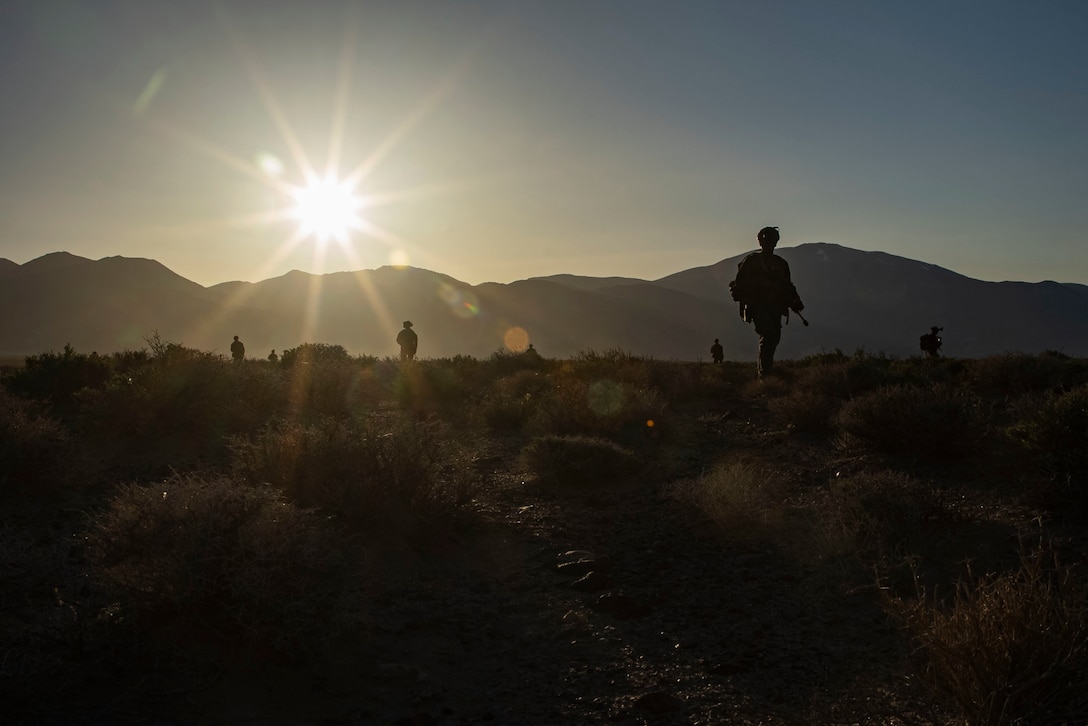 U.S. Marines with Bravo Company, 1st Battalion, 2nd Marine Regiment, 2nd Marine Division and U.S. Soldiers with 5th Special Forces Group (Airborne), 1st Special Forces Division maneuver toward an objective at Hawthorne Army Depot, Nevada, April 19, 2022. Marines and Soldiers were flown to Hawthorne Army Depot to conduct a high-altitude night raid exercise at an urban facility. (U.S. Marine Corps photo by Lance Cpl. Luis Aguilar)