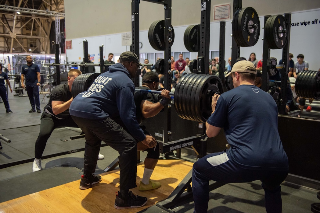 Capt. Anthony Bilal, an Air Force Life Cycle Management Center contracting officer, performs the squat portion of the powerlifting competition Dec. 10, 2022, at Wright Field Fitness Center on Wright-Patterson Air Force Base, Ohio. Bilal went on to be the event’s overall winner for the second straight year. (U.S. Air Force photo by Staff Sgt. Mikaley Kline)