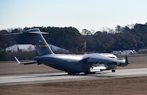 A aircraft prepares to take off on a runway.