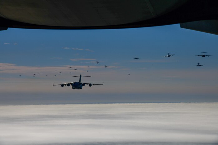 A photo of 24 Aircraft fly in formation.