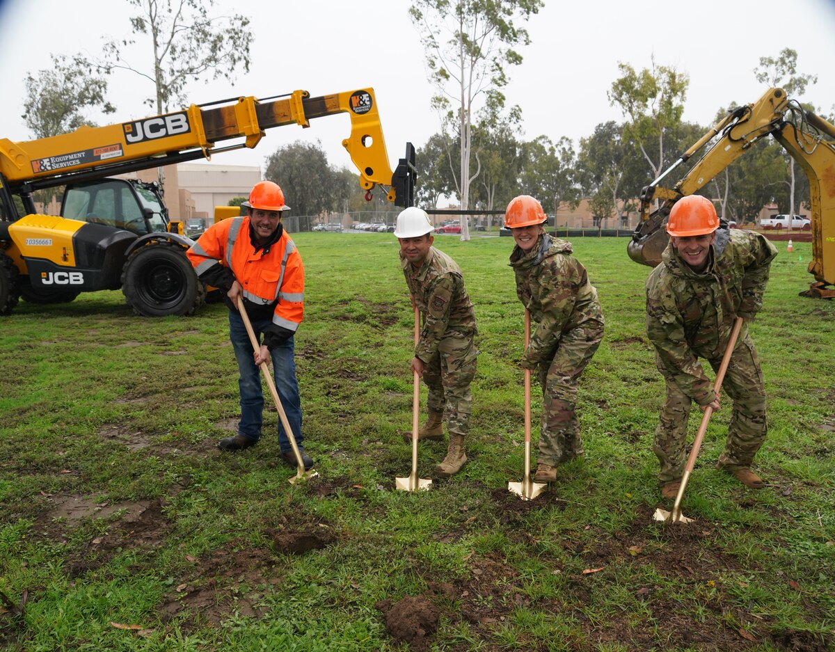 A Department of Defense contractor, U.S. Air National Guard Maj. Timothy Chow, commander 146th Civil Engineer Squadron, Col. Lisa A. Nemeth, commander 146th Airlift Wing, and Col. Christopher Dougherty, vice commander 146th Airlift Wing, participate in a groundbreaking ceremony for the wing's new C-130J simulator at the Channel Islands Air National Guard Station, Port Hueneme, California, Jan. 5, 2023. The new simulator or Weapons System Trainer Reconfigurable C-130J flight simulator (also known as WST 12R) will showcase a myriad of capabilities that will separate it from other simulators across the United States. (U.S. Air National Guard photo by Staff Sgt. Michelle Ulber)