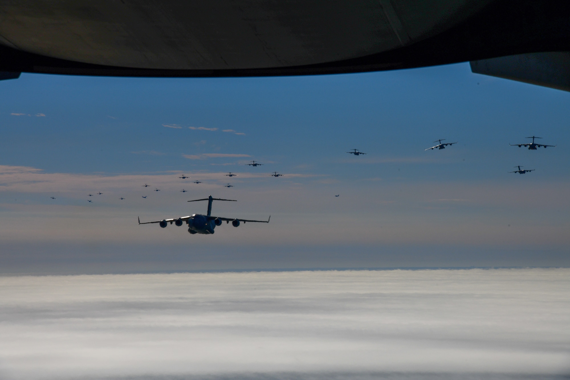 A photo of 24 Aircraft fly in formation.