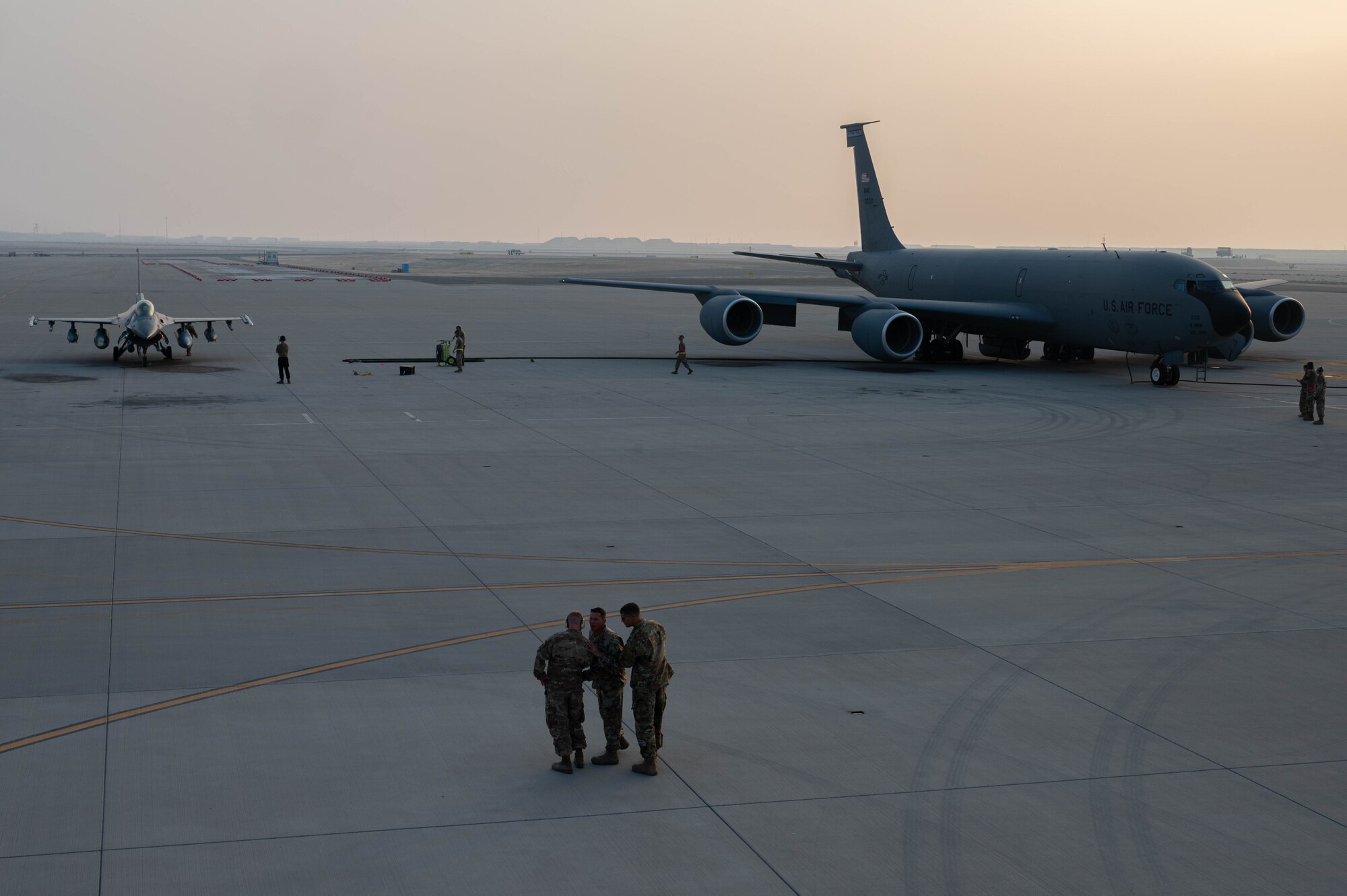 U.S. Air Force Airmen conduct an aircraft-to-aircraft refueling with a KC-135 Stratotanker and F-16 Fighting Falcon