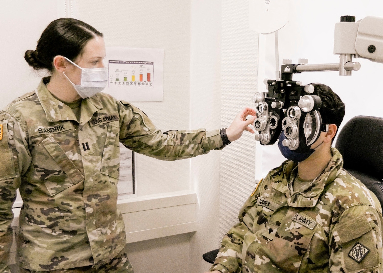 A Soldier with U.S. Army Health Clinic Baumholder performs an eye examination on a Soldier with the 44th Expeditionary Signal Battalion-Enhanced, 2nd Theater Signal Brigade, during a medical readiness rodeo at USAHC Baumholder, Dec. 12. The event assembled individual medical readiness elements to expedite annual medical requirements for Soldiers with the 44th ESB-E.