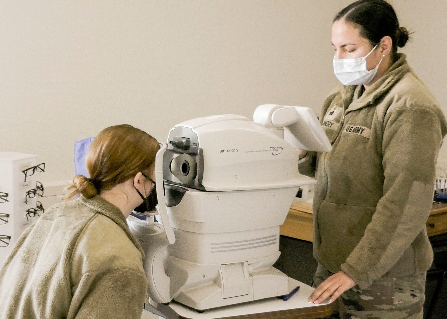 A Soldier with U.S. Army Health Clinic Baumholder performs an eye examination on a Soldier with the 44th Expeditionary Signal Battalion-Enhanced, 2nd Theater Signal Brigade, during a medical readiness rodeo at USAHC Baumholder, Dec. 12. The event assembled individual medical readiness elements to expedite annual medical requirements for Soldiers with the 44th ESB-E.