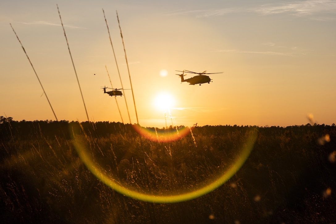 U.S. Marine Corps CH-53 Super Stallions with Marine Medium Tiltrotor Squadron (VMM) 162 (Reinforced), 26th Marine Expeditionary Unit, prepare to land at Marine Corps Outlying Field Oak Grove, North Carolina, Dec. 13, 2022. Marines with VMM-162 and the Battalion Landing Team 1/6 conducted flight operations heading to a forward arming and refueling point (FARP) during Marine Expeditionary Unit Exercise 1. FARPs are designed to supply fuel and ordnance necessary during helicopter and fixed-wing operations. (U.S. Marine Corps photo by Cpl. Kyle Jia)