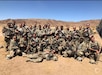 Soldiers from the 469th Combat Engineer Company Infantry, Machesney Park, Ill., pose for a team photo at the National Training Center in 2021.