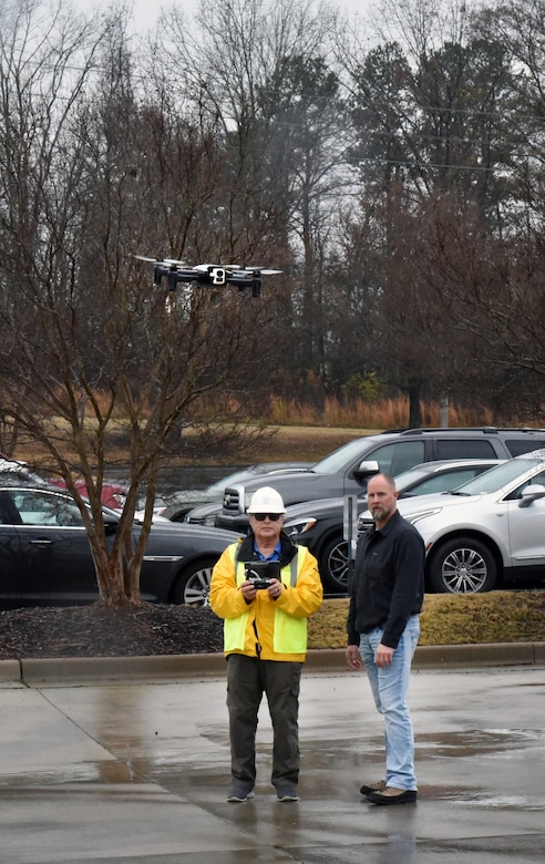 Steve Lamas, visual information specialist, and Ryan Strange, research physical scientist for the Unmanned Aircraft Systems program at Huntsville Center, use an unmanned aerial vehicle to provide aerial images of a simulated accident scene during the Safety Investigation Board training at the U.S. Army Engineering and Support Center, Huntsville in December.