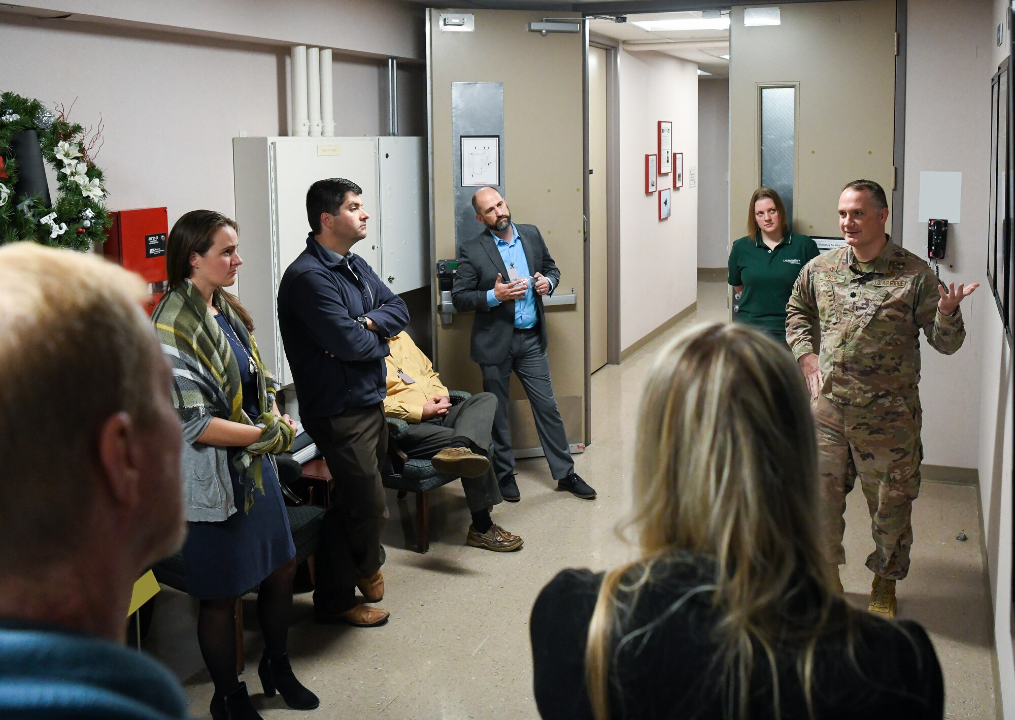Lt. Col. Dayvid Prahl, commander, 718th Test Squadron, speaks to a group of people about the various test capabilities the squadron offers for testing space and missile systems as part an Air Force Test Center group touring Arnold Air Force Base, Tennessee.