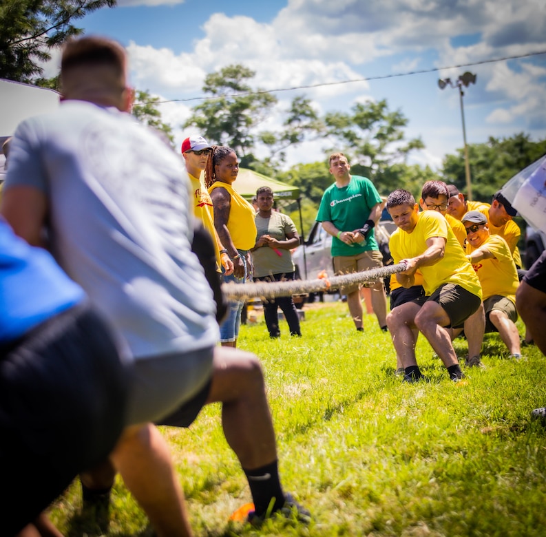 Soldiers compete in a tug of war contest during the annual Organizational Day carnival.