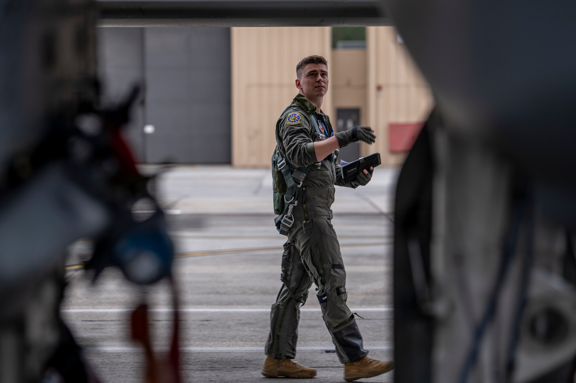 A pilot conducts a pre-flight check.