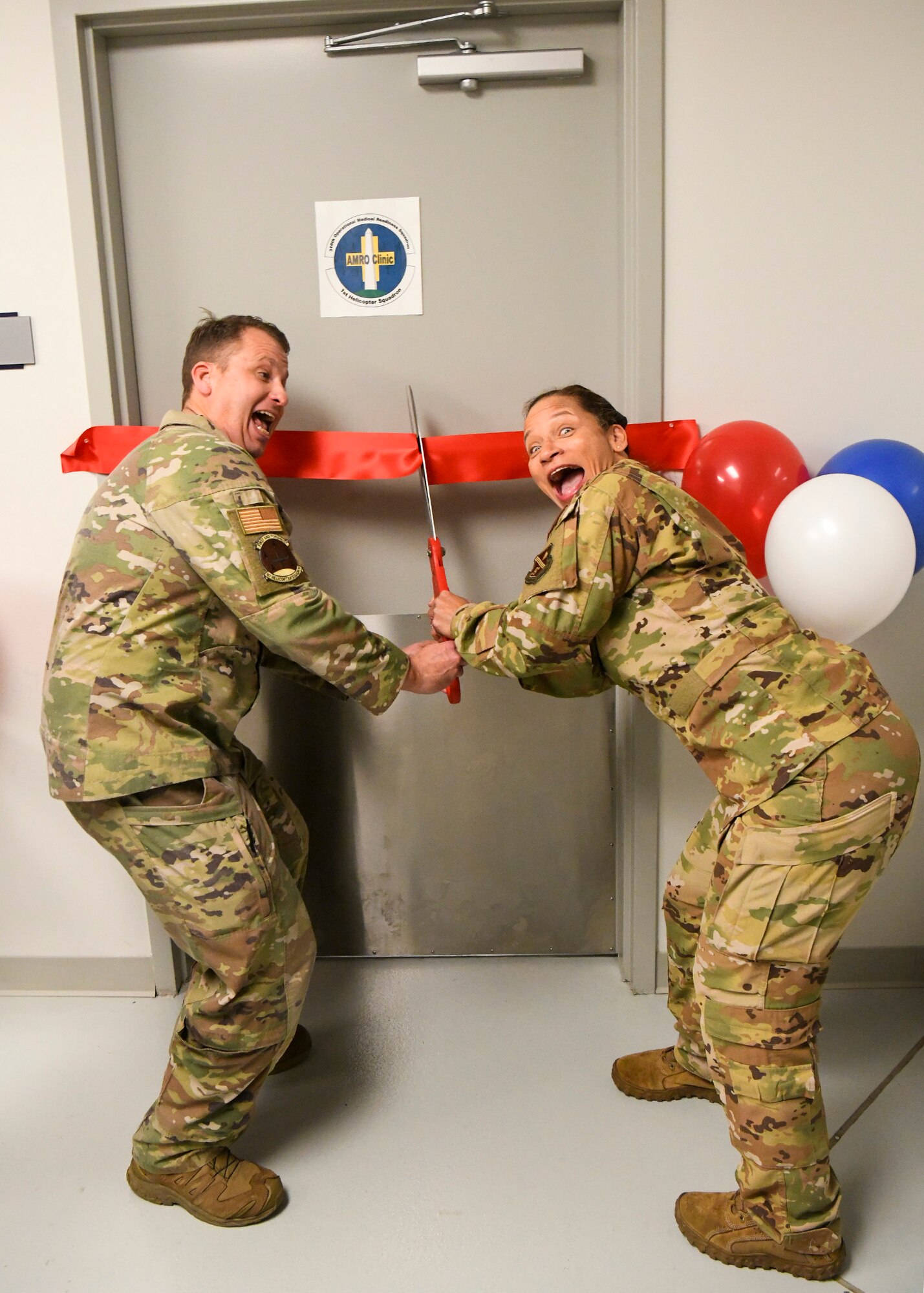 Col. Stefanie Watkins Nance, right, 316th Operational Medical Readiness Squadron commander, and Lt. Col. Bill Root, 1st Helicopter Squadron commander, cut the ribbon to the chiropractic clinic at the 1 HS at Joint Base Andrews, Md., Jan. 4, 2023.