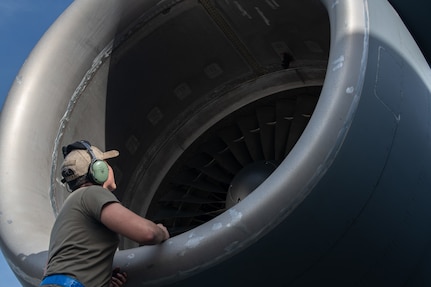 An Airman inspects a C-17 Globemaster III