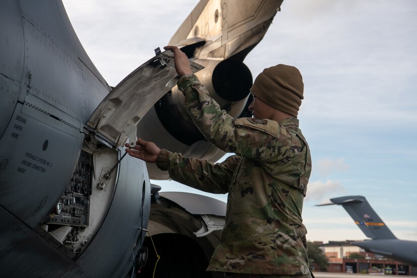 An Airman prepares a C-17 Globemaster III for refueling.