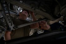 Airmen inspect a C-17 Globemaster III