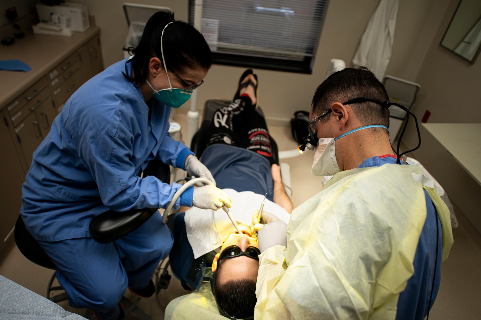 Dentist works on patient
