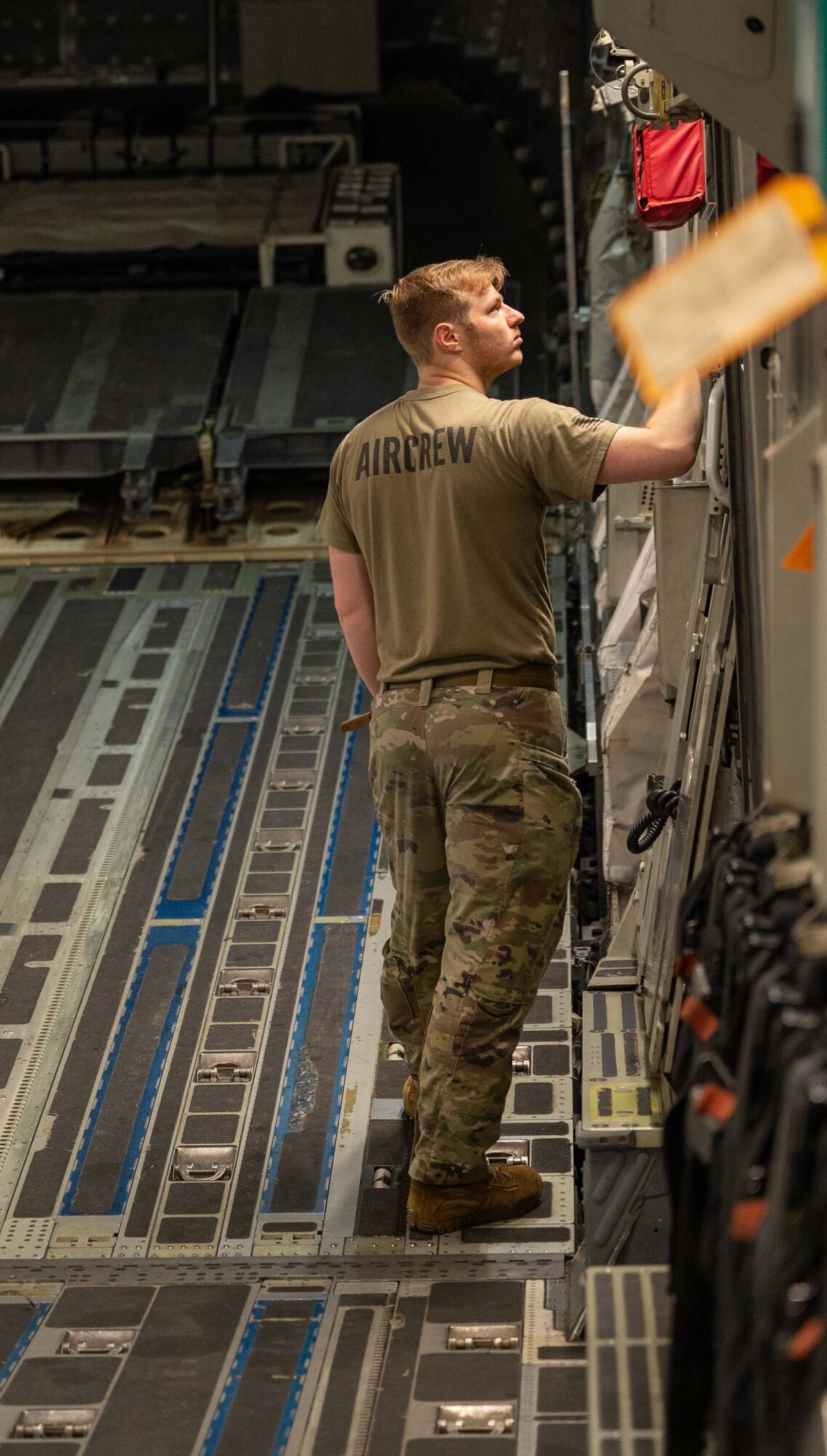 Airman 1st Class Jasper Wickman, 3rd Airlift Squadron loadmaster, performs pre-flight checks in the cargo compartment of a C-17 Globemaster III before a local training flight at Dover Air Force Base, Delaware, Jan. 4, 2023. Aircrew from the 3rd AS train regularly to maintain optimal mission readiness to support global airlift. This local training mission enabled aircrew from the 9th AS to retrieve a C-5M Super Galaxy from Westover Air Reserve Base, Massachusetts, where it was serviced in the isochronal dock. (U.S. Air Force photo by Senior Airman Faith Barron)
