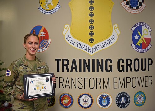 Space Force 2nd Lt. Emily Riter holds the Guardian of the Month certificate at Goodfellow Air Force Base, Texas, Jan. 4, 2023. Guardian of the Month recognizes a Guardian that exhibits Space Force core values. (U.S. Air Force photo by Airman 1st Class Sarah Williams)