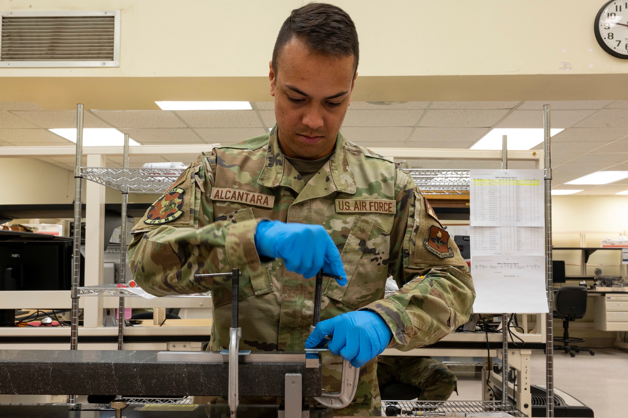 U.S. Air Force Senior Airman Fernando Alcantara, 49th Component Maintenance Squadron physical dimensional technician, uses a sine bar calibrator at Holloman Air Force Base, New Mexico, Jan. 6, 2023.