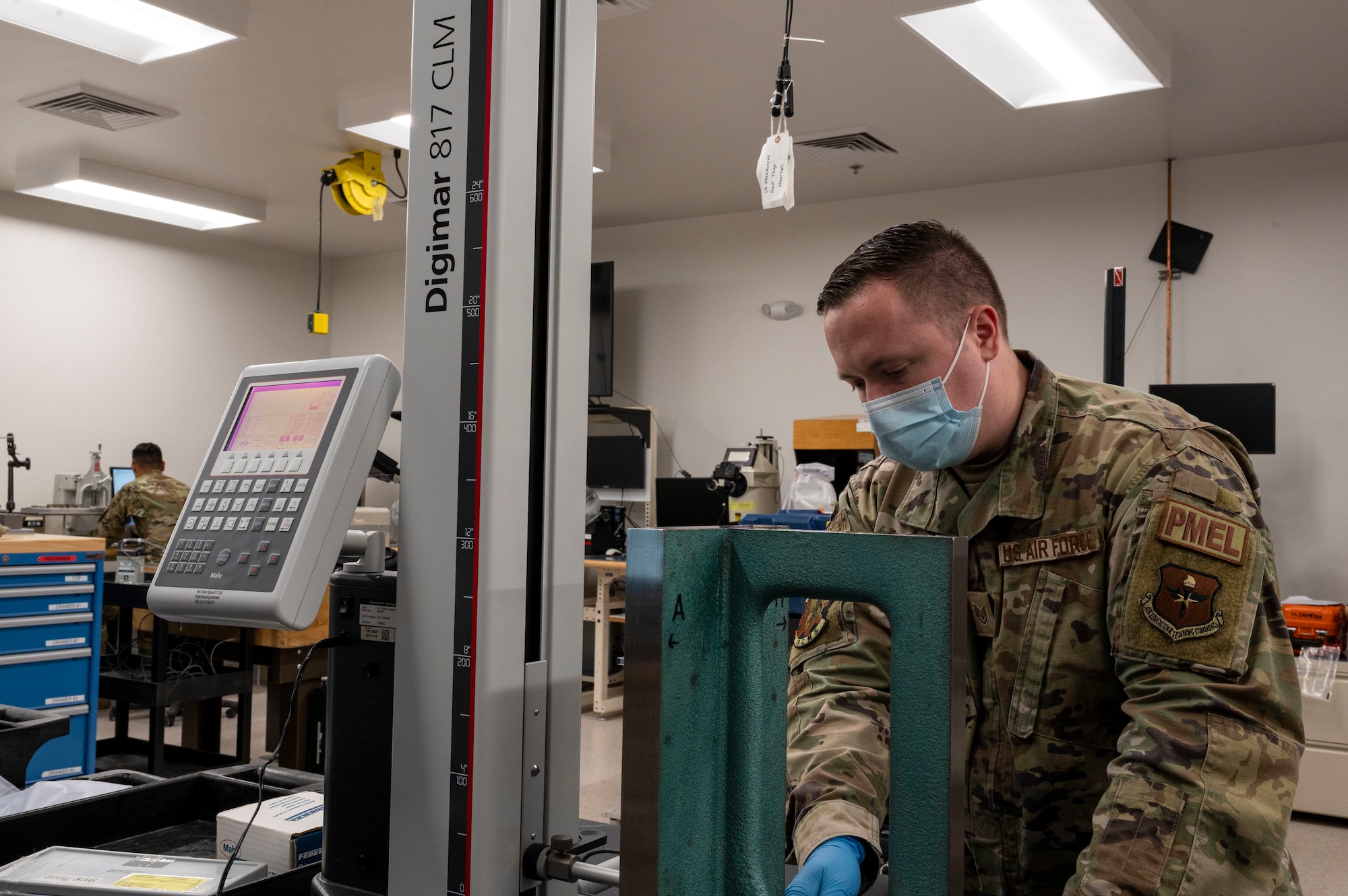 U.S. Air Force Staff Sgt. Kyle Jackson, 49th Component Maintenance Squadron physical dimensional supervisor, uses a 817 CLM to measure the surface of an angle iron at Holloman Air Force Base, New Mexico, Jan. 6, 2023.