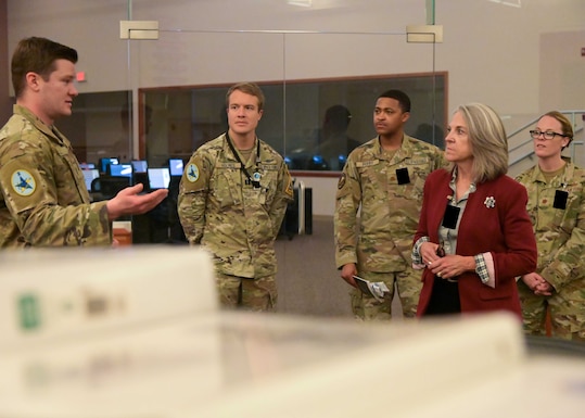 Angie Dickinson, spouse of U.S. Army Gen. James Dickinson, United States Space Command commander, is briefed by the 2nd Range Operations Space Force Officers at Vandenberg space Force Base, Calif., Jan. 5, 2023. The brief and tour of the Western Range Operations Control Center to display Vandenberg’s commercial launch capabilities. (U.S. Space Force photo by Senior Airman Rocio Romo)