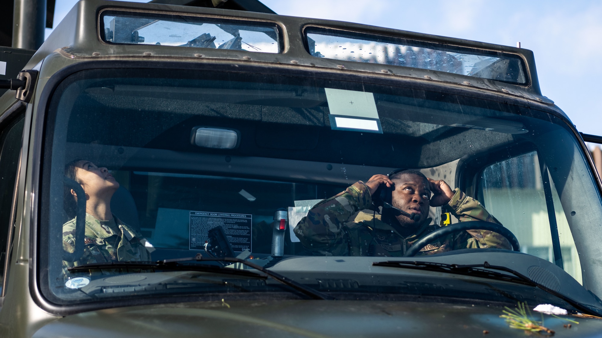 U.S. Airmen assigned to the 35th Logistics Readiness Squadron operate an extended deicer at Misawa Air Base, Japan, Dec. 20, 2022. After the primary deicer broke down beyond repair, 35th Logistics Readiness Squadron members coordinated the arrival of a new deicer to resume the mission of clearing off Misawa Air Bases’ F-16 Fighting Falcons. (U.S. Air Force photo by Staff Sgt. Kristen Heller)