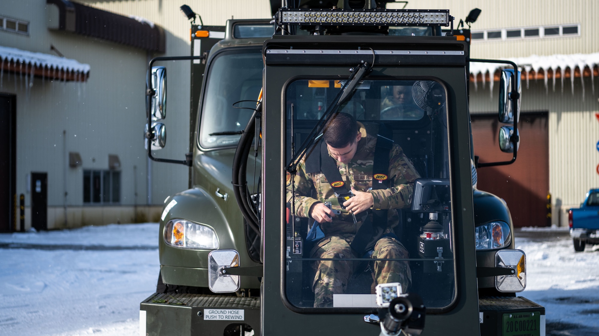 U.S. Airmen assigned to the 35th Logistics Readiness Squadron operate an extended deicer at Misawa Air Base, Japan, Dec. 20, 2022. After the primary deicer broke down beyond repair, 35th Logistics Readiness Squadron members coordinated the arrival of a new deicer to resume the mission of clearing off Misawa Air Bases’ F-16 Fighting Falcons. (U.S. Air Force photo by Staff Sgt. Kristen Heller)