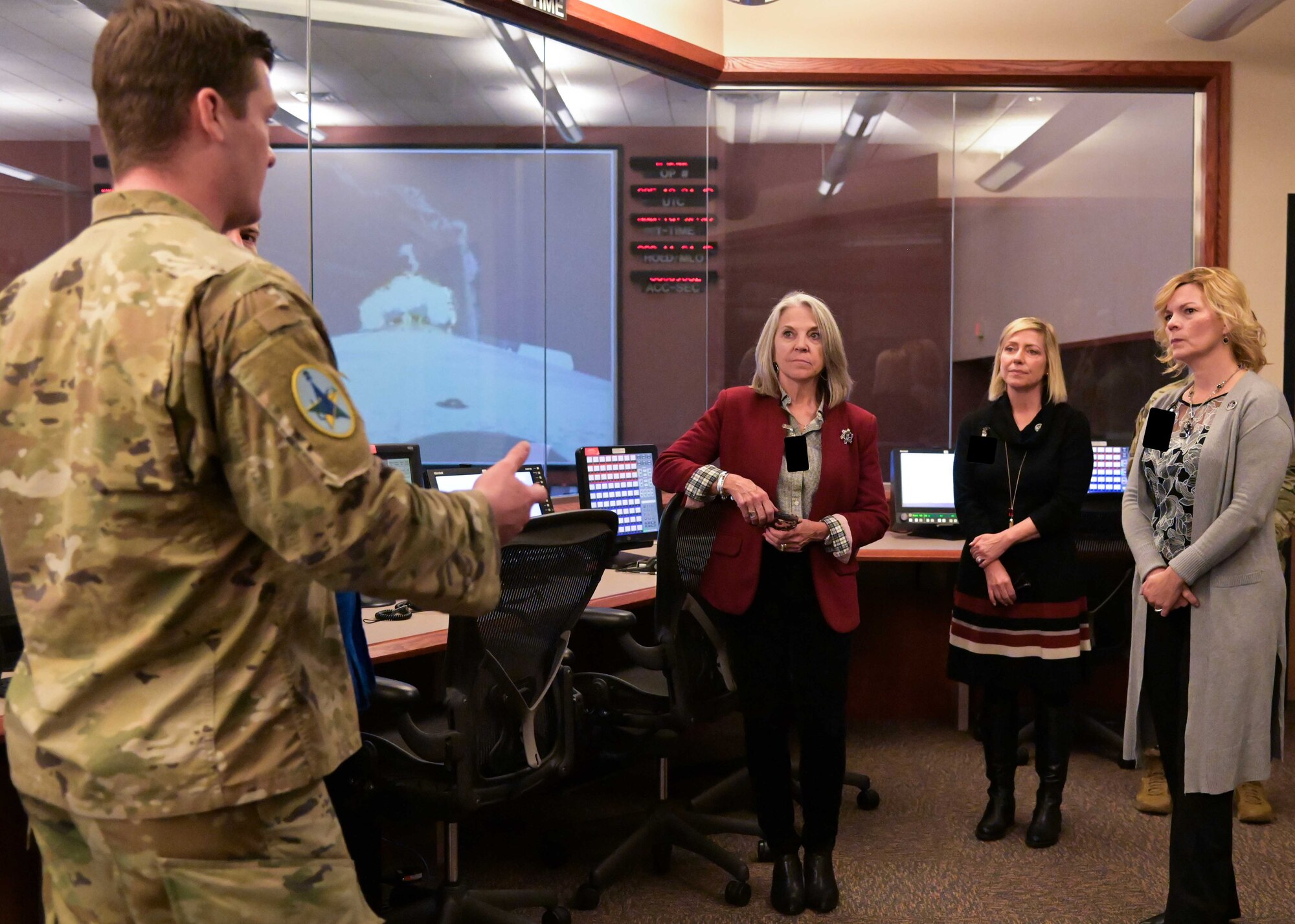 Angie Dickinson, spouse of U.S. Army Gen. James Dickinson, United States Space Command commander, is briefed by the 2nd Range Operations Space Force Officers at Vandenberg space Force Base, Calif., Jan. 5, 2023. The brief and tour of the Western Range Operations Control Center to display Vandenberg’s commercial launch capabilities. (U.S. Space Force photo by Senior Airman Rocio Romo)