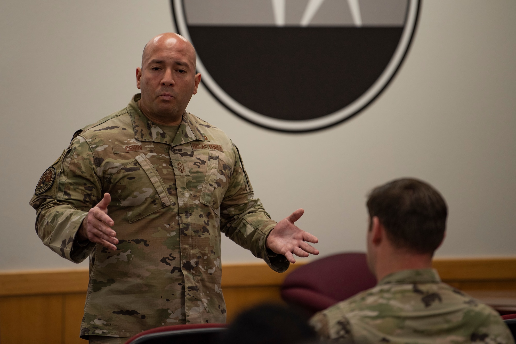 Chief Master Sgt. Steve Cenov, 8th AF command chief and J-GSOC senior enlisted leader, provides feedback to a group of NCOs and SNCOs during a professional development question & answer session at Dyess Air Force Base, Texas, Jan. 6, 2023. The 8th Air Force command team used the visit as an opportunity to discuss the importance of Striker Airmen and the role they play in support of strategic deterrence and the global strike mission.  (U.S. Air Force photo by Airman 1st Class Ryan Hayman)