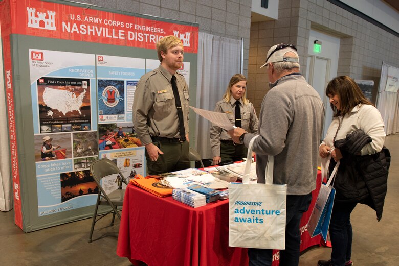 Park Rangers John Poston and Chee Hill from Old Hickory Lake assist visitors to the Nashville Boat Show at Music City Center in Nashville, Tennessee, Jan. 5, 2023. The U.S. Army Corps of Engineers Nashville District is promoting water and boating safety and providing information about recreation at the event. (USACE Photo by Lee Roberts)
