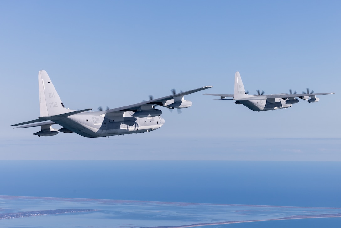 U.S. Marines with Marine Aerial Refueler Transport Squadron (VMGR) 252 fly KC-130J Hercules airplanes in formation over the coast of North Carolina, Dec. 29, 2022. Marines with VMGR-252 flew in formations and simulated an air delivery to increase proficiency among air crew and pilots. VMGR-252 is a subordinate unit of 2nd Marine Aircraft Wing, the aviation combat element of II Marine Expeditionary Force. (U.S. Marine Corps photo by Cpl. Adam Henke)
