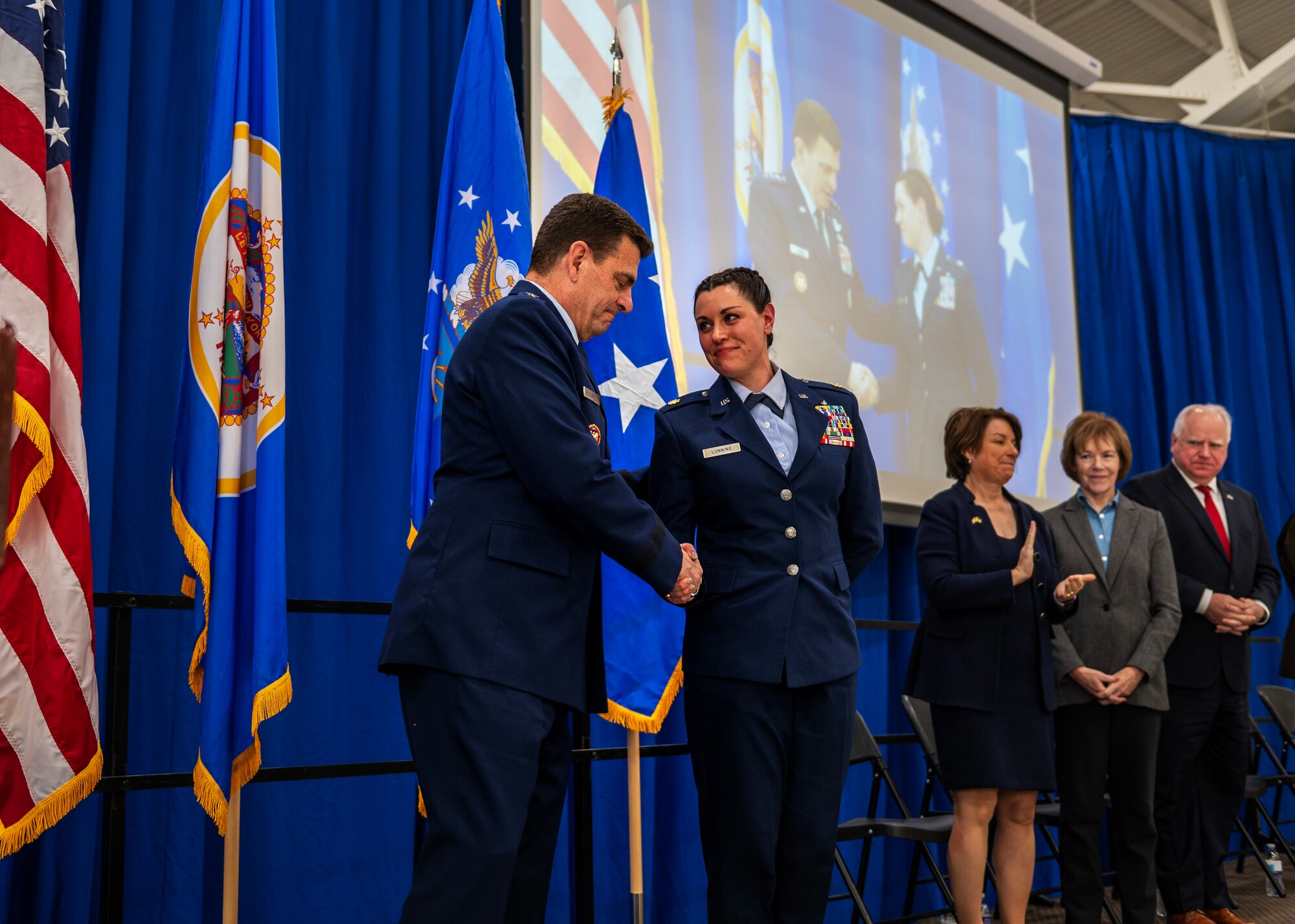 U.S. Air Force Lt. Gen. Michael A. Loh, Director of the Air National Guard, congratulates the accomplishments of the 133rd Airlift Wing’s Maj. Katie Lunning in St. Paul, Minn., Jan. 7, 2023.