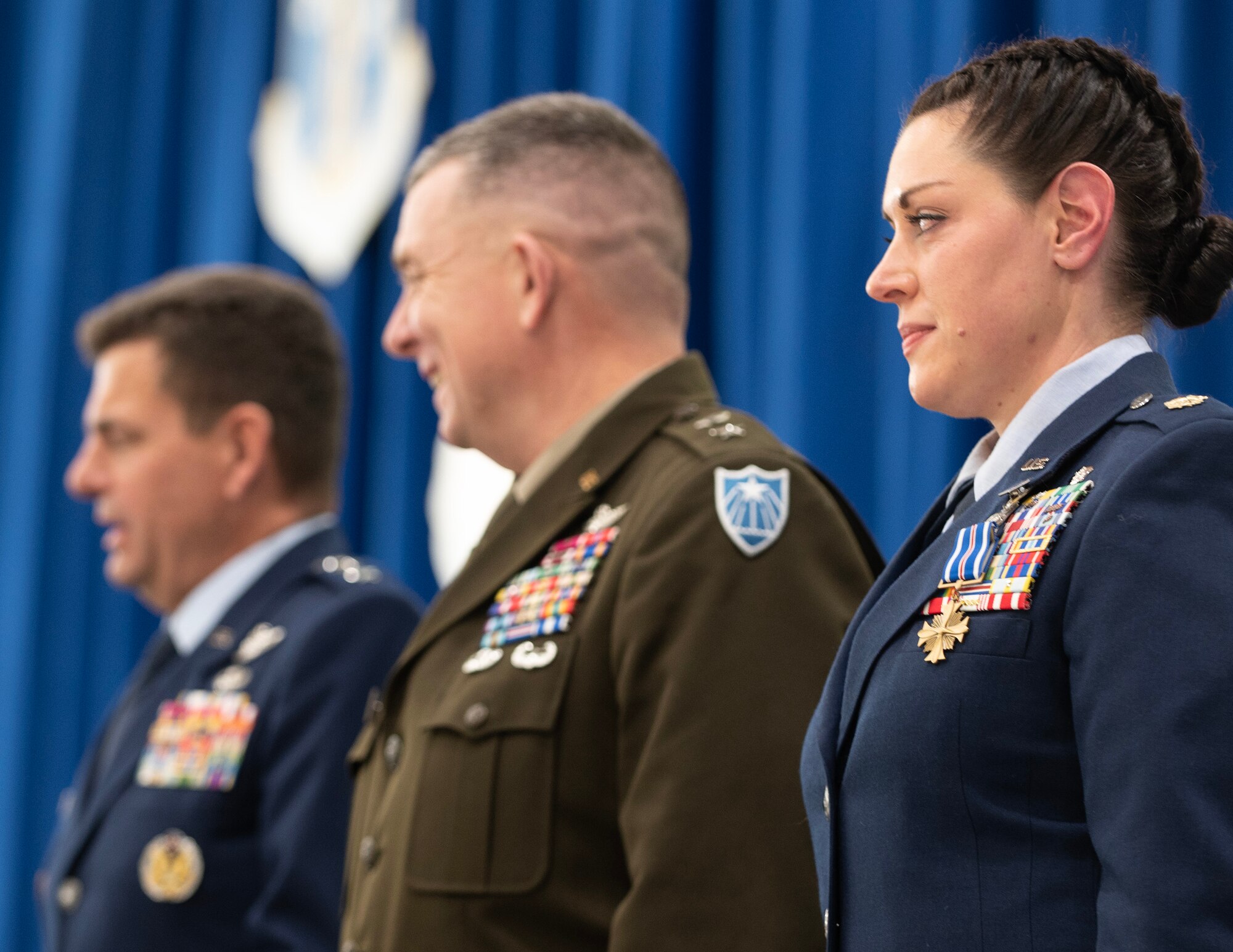 U.S. Air Force Maj. Katie Lunning, right, 133rd Medical Group, waits to depart the stage, Jan. 7, 2023, St. Paul, Minn.