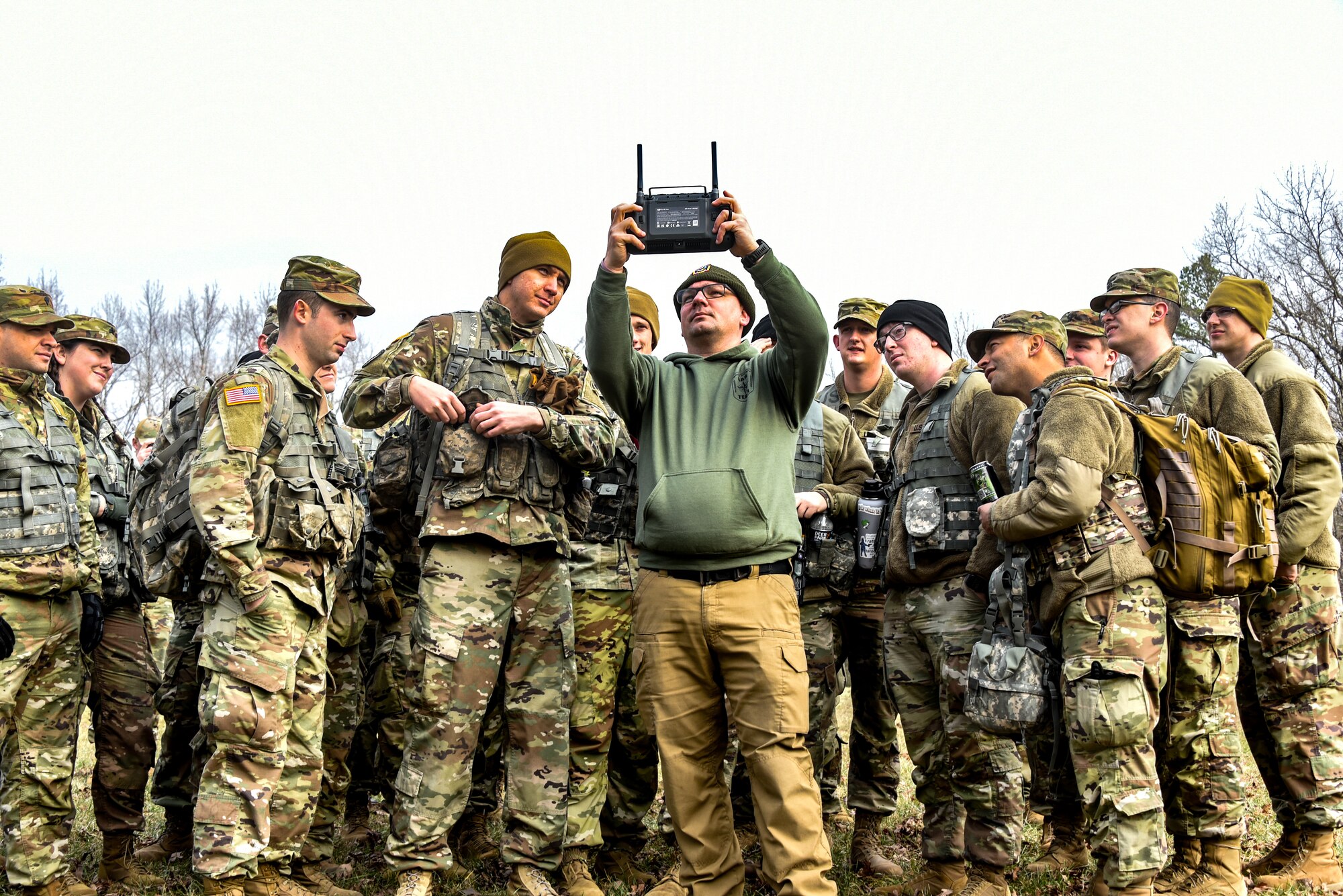 a group of soldiers observe a drone receiver