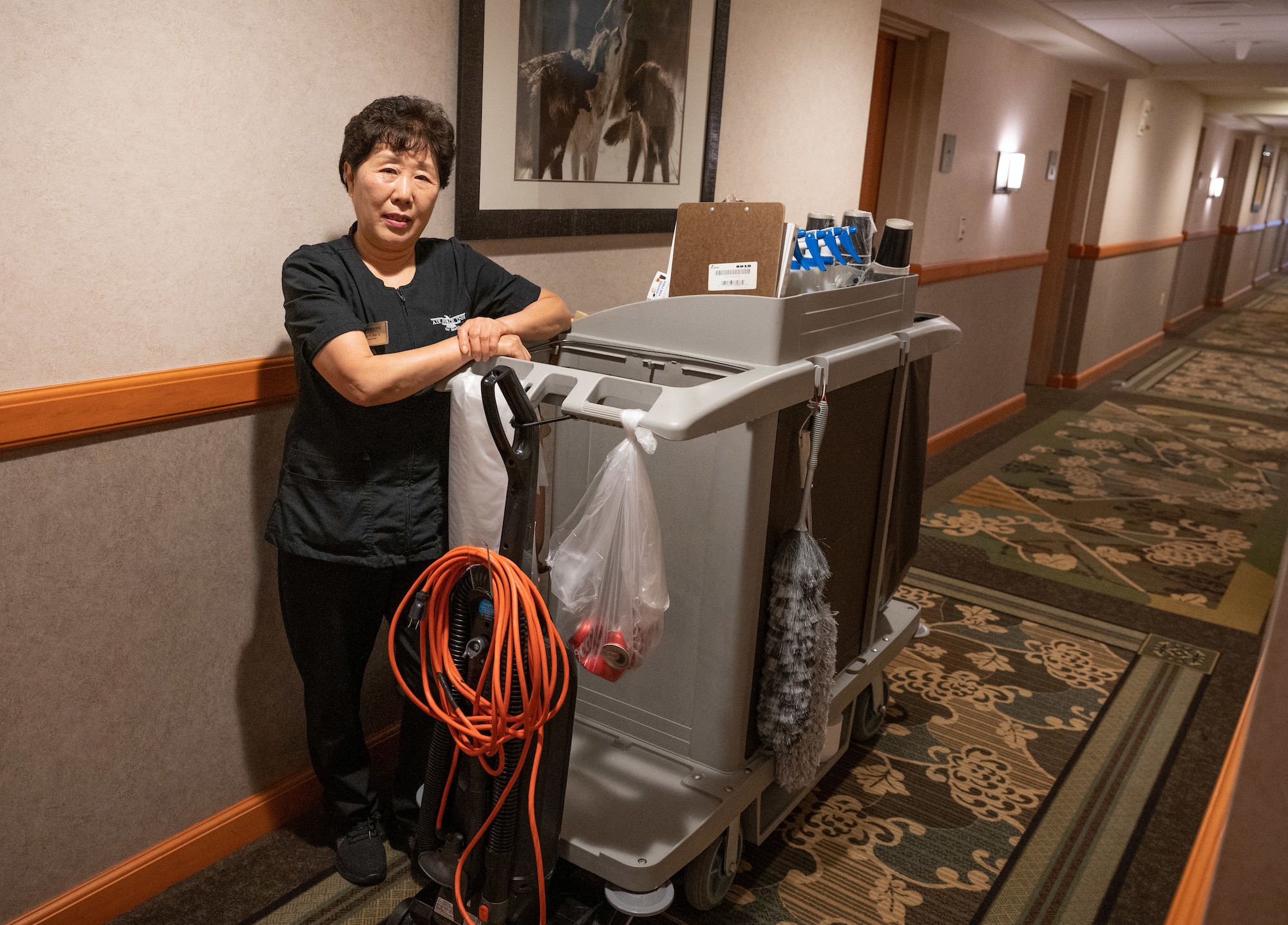Kwi Ye Yi, 8th Force Support Squadron custodial worker, poses for a photo in the Wolf Pack Lodge at Kunsan Air Base, Republic of Korea, Jan. 5, 2023. Not only does the Wolf Pack Lodge service distinguished visitors and Airmen, they also support U.S. servicemembers who stay at Kunsan for temporary duties. (U.S. Air Force photo by Staff Sgt. Sadie Colbert)
