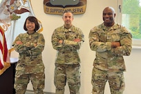 (L to R) 1st Lt. Ying Jiang and Maj. Jonathan Evans, 21st Theater Sustainment Command, 266th Finance Support Center and Sgt. First Class Willie Cole, 21st Special Troops Battalion Headquarters Company First Sergeant discussed counter threat finance in the historic Clock Tower Building on Kleber Kaserne, Kaiserslautern, Germany in September, 2022. Counter threat finance activities prevent, disrupt, and deny the financial freedom of nefarious actors throughout Europe and Africa.