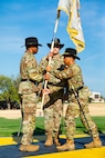 Command Sgt. Maj. Ronald B. Oyardo, 15th, Finance Support Battalion (right), passes the colors to Col. Anthony L. Wilson Sr, commander, 1st Cavalry Division Sustainment Brigade (left), symbolizing Lt. Col. Ralph Schneider IV assumption of command of the 15th Finance Battalion on August 17, 2022, at Fort Hood, TX. The activation ceremony is significant because the 15th Finance Battalion, originally called the 15th Finance Company, was assigned to the 1st Cavalry Division when it was first created on March 15, 1971, before it was redesignated.  (Photo by U.S. Army SGT Froylan Grimaldo, 1st Cavalry Division Public Affairs)