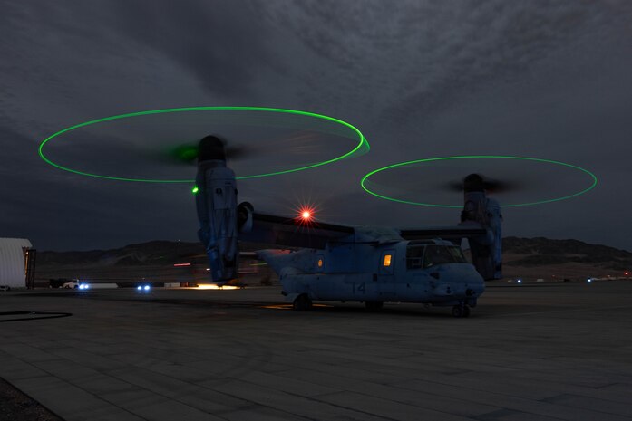 A U.S. Marine Corps MV-22B Osprey with Marine Medium Tilt Rotor Squadron 165, Marine Air Group 16, 3rd Marine Aircraft Wing, stages by the fuel line at a forward arming and refueling point during Steel Knight 23 Dec. 1, 2022, on Camp Wilson, Marine Corps Air Ground Combat Center Twentynine Palms. Exercise Steel Knight 23 provides 3rd MAW an opportunity to refine Wing-level warfighting in support of I Marine Expeditionary Force and fleet maneuver.