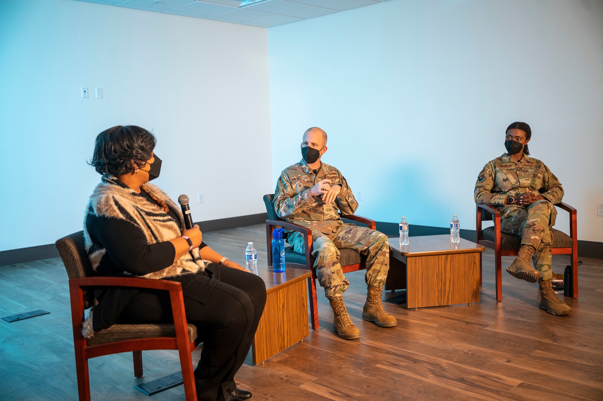Brig. Gen. Matthew Higer, Commander, 412th Test Wing and CMSgt. Denisha Ward-Swanigan, Command Chief Master Sergeant, 412th Test Wing speak with Ms. Carolyn Graves, Sexual Assault Response Coordinator during the live Town Hall at the new Helping Agencies facility at Edwards Air Force Base, California, Jan. 6.