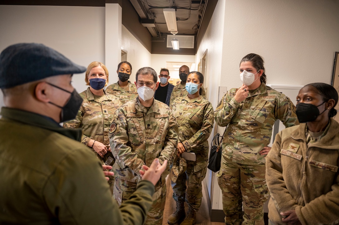 KrisRyan I. Borsil, Diversity, Equity, Inclusion and Accessibility Office Affirmative Employment Program Manager, 412 TW/DEE guides Airmen through the new Helping Agencies facility at Edwards Air Force Base, California, Jan. 6.