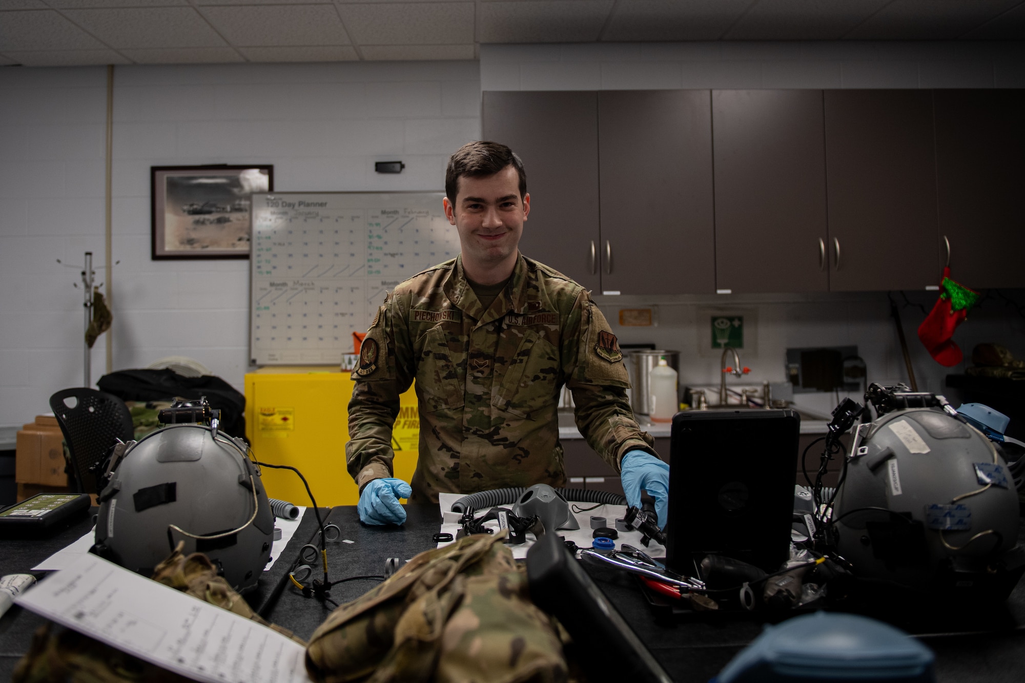 Airman looking at equipment