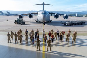 U.S. Air Force Airmen assigned to the 521st Air Mobility Operations Wing pose for a unit photo, Sept. 12, 2022, at Ramstein Air Base, Germany.