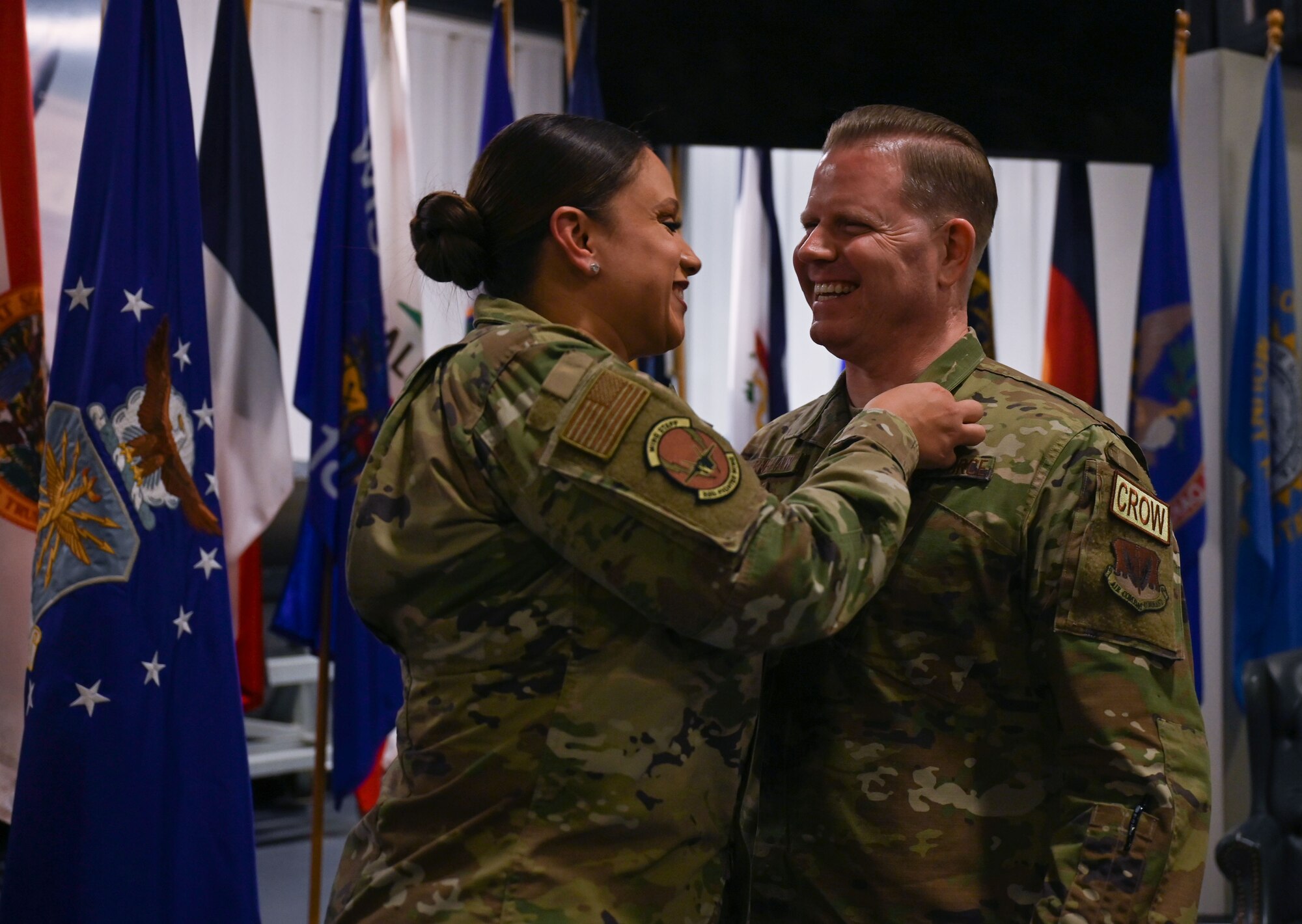 U.S. Air Force Senior Master Sgt. Sharry Barnshaw, 33rd Fighter Wing senior enlisted leader, pins a retirement lapel on her husband Chief Master Sgt. Jason Barnshaw, 850th Spectrum Warfare Group senior enlisted leader, during his retirement ceremony at Eglin Air Force Base, Fla., Jan. 6, 2023. Throughout his time as the 850th SWG, his outstanding professional skill, leadership, and ceaseless efforts resulted in major contributions to the effectiveness and success of the creation of the first ever spectrum warfare group. (U.S. Air Force photo by Staff Sgt. Ericka A. Woolever)