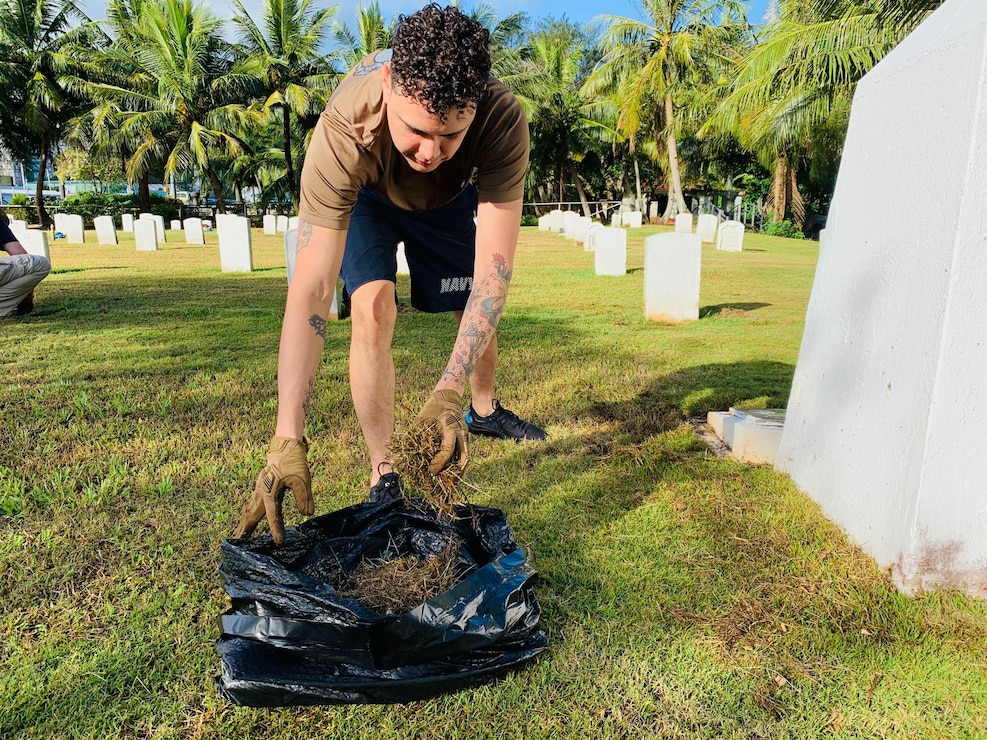 HAGÅTÑA, Guam (Dec. 15, 2022) - Sailors and civilians from U.S. Naval Base Guam (NBG) and various tenant commands volunteered as part of a clean-up at the U.S. Naval Cemetery in Hagåtña, Dec. 15. Volunteers from NBG Security, NBG Emergency Operations Center, Naval Hospital Guam, 30th Naval Construction Regiment, and USS Emory S. Land removed debris and weeds from gravesites throughout the cemetery. The clean-up is in anticipation of the annual Wreaths Across America Day on Dec. 17.