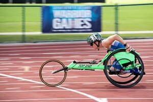 Major Heather Sealover racing in the wheelchair track portion of the 2022 Warrior Games