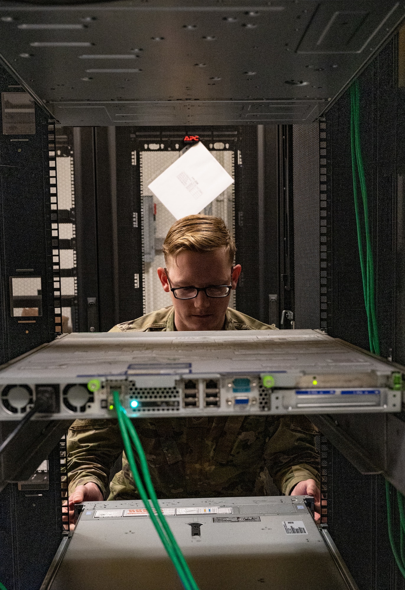 Staff Sgt. Spencer Pearce, 8th Communications Squadron cyber defense vulnerability NCO in charge, checks a server rack at Kunsan Air Base, Republic of Korea, Jan. 9, 2023. The cyber defense 365-team can remotely correct a user’s cyber threat protective measures, one of the many ways adversaries try to infiltrate an installation’s network. (U.S. Air Force photo by Staff Sgt. Sadie Colbert)